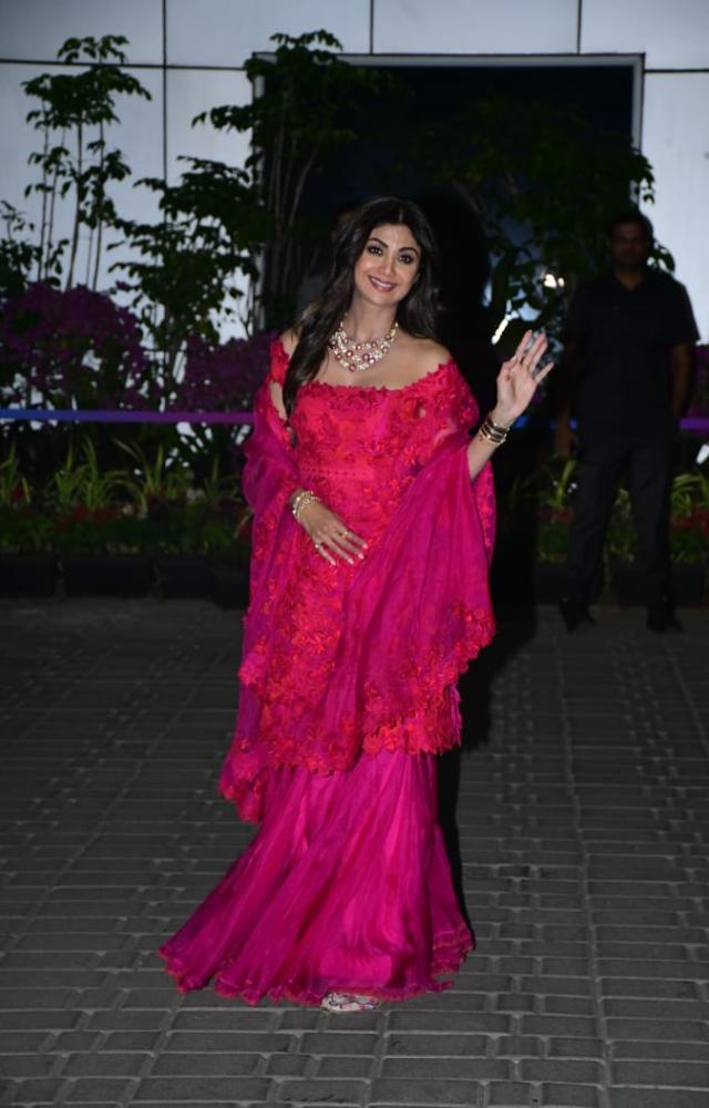 The actress looked stunning in a bright pink Indian wear and waved to the paparazzi clicking her 