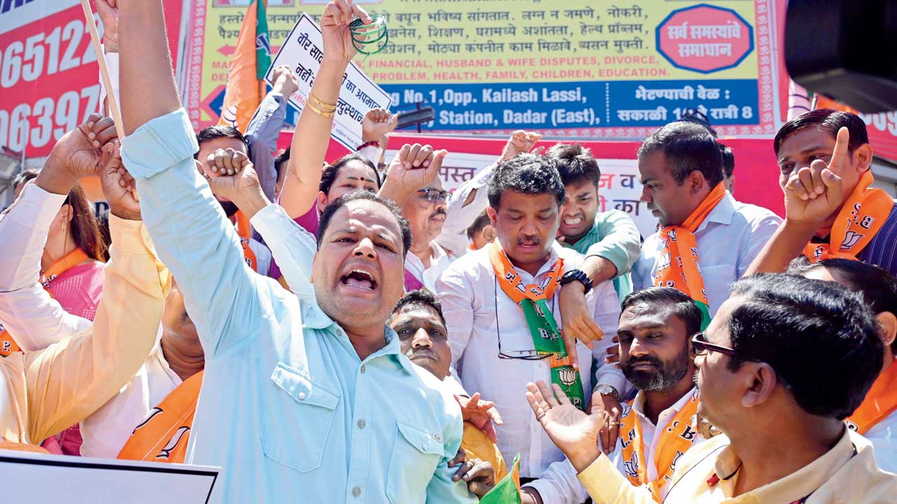 BJP party workers protest against Rahul Gandhi for his recent comments on Savarkar and the OBC community, near Dadar station earlier this month