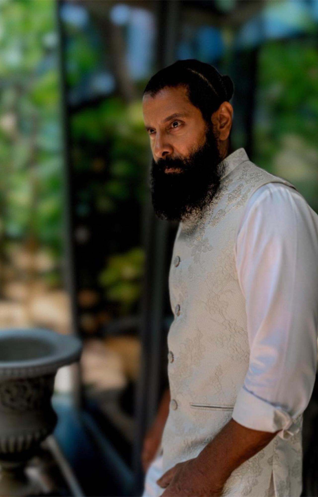 With this white jacket and kurta, Vikram proved that the man bun goes well with an ethnic look, too. The actor was seen sporting a cream-coloured embroidered jacket with a white kurta-pyajama. 