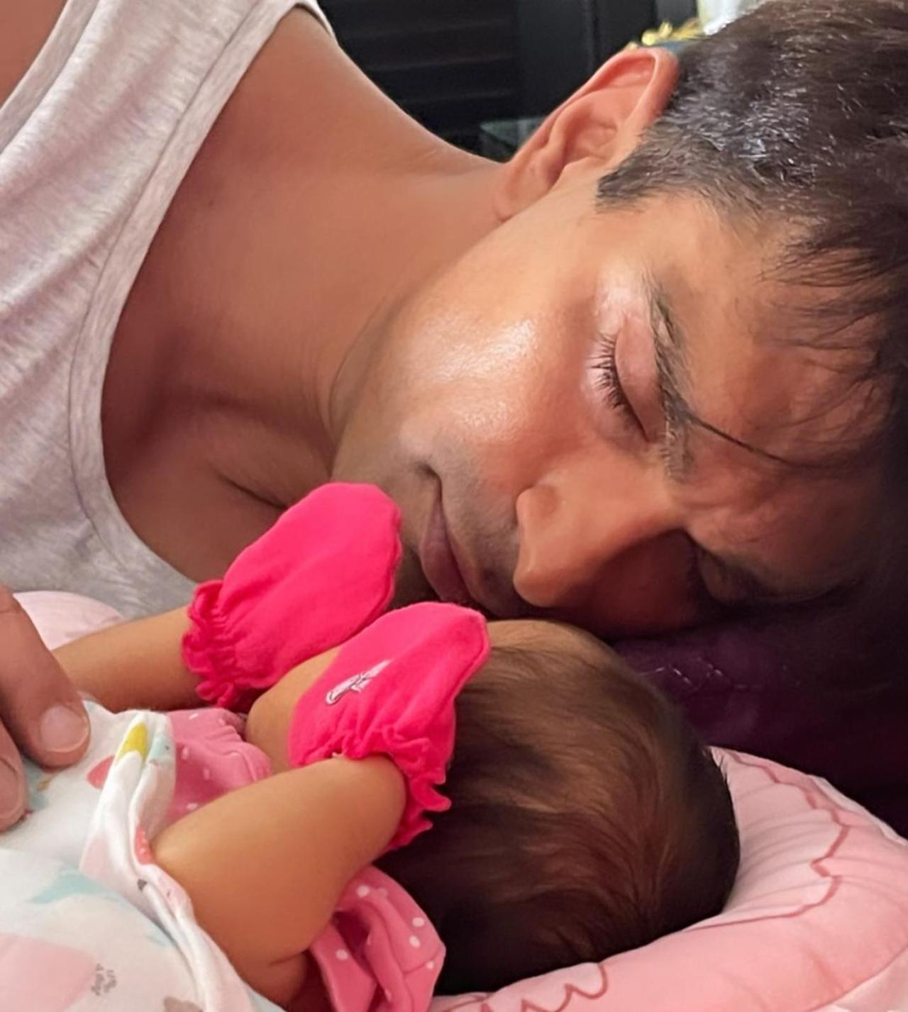 Bipasha had shared this picture of Karan Singh Grover taking a nap beside their new born. The picture was clicked when Devi was less than a month old