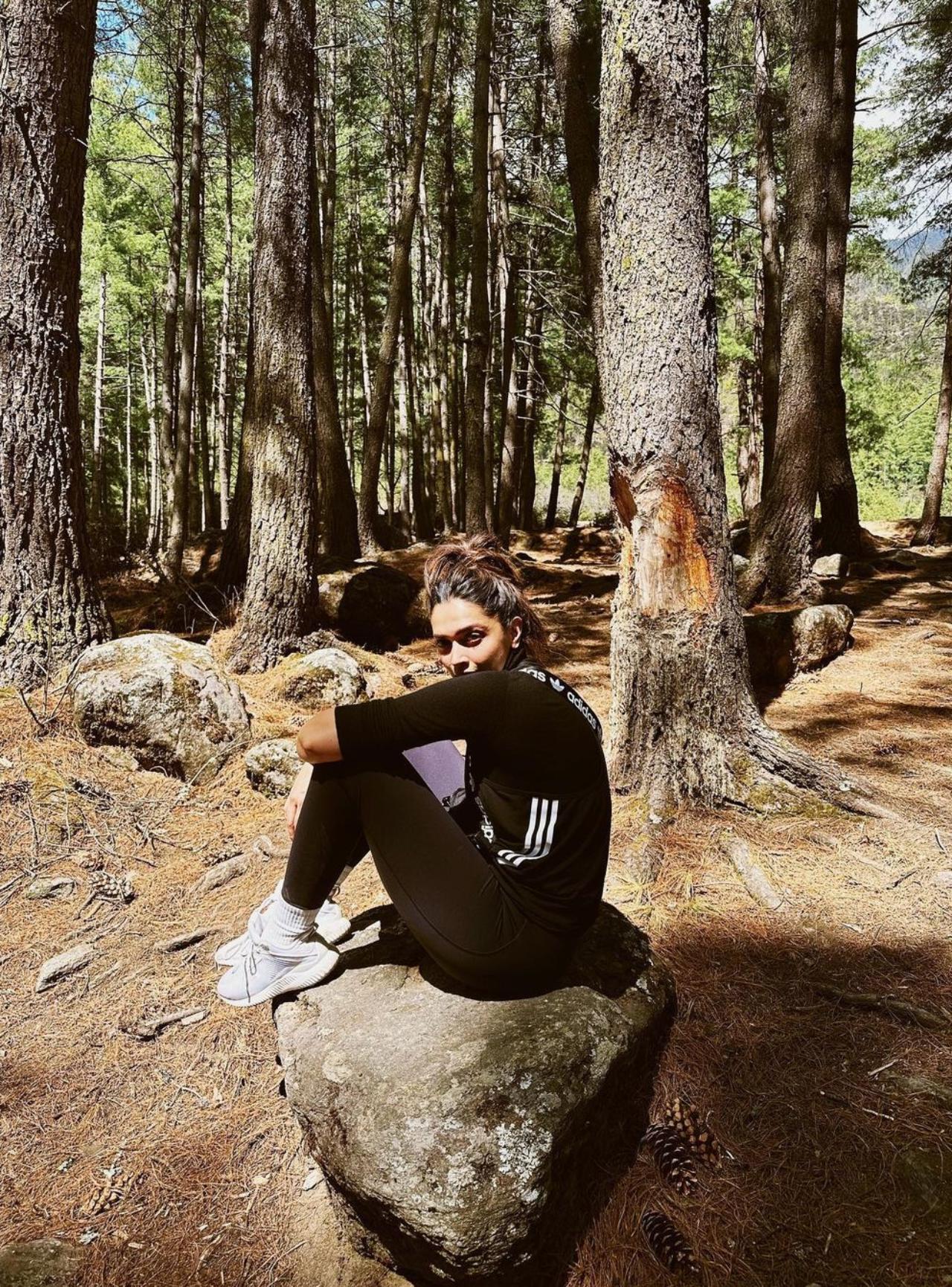 Deepika Padukone took to her Instagram feed and shared multiple posts from her visit to Bhutan. She started her sharing spree with a picture of herself sitting on a big rock surrounded by foliage