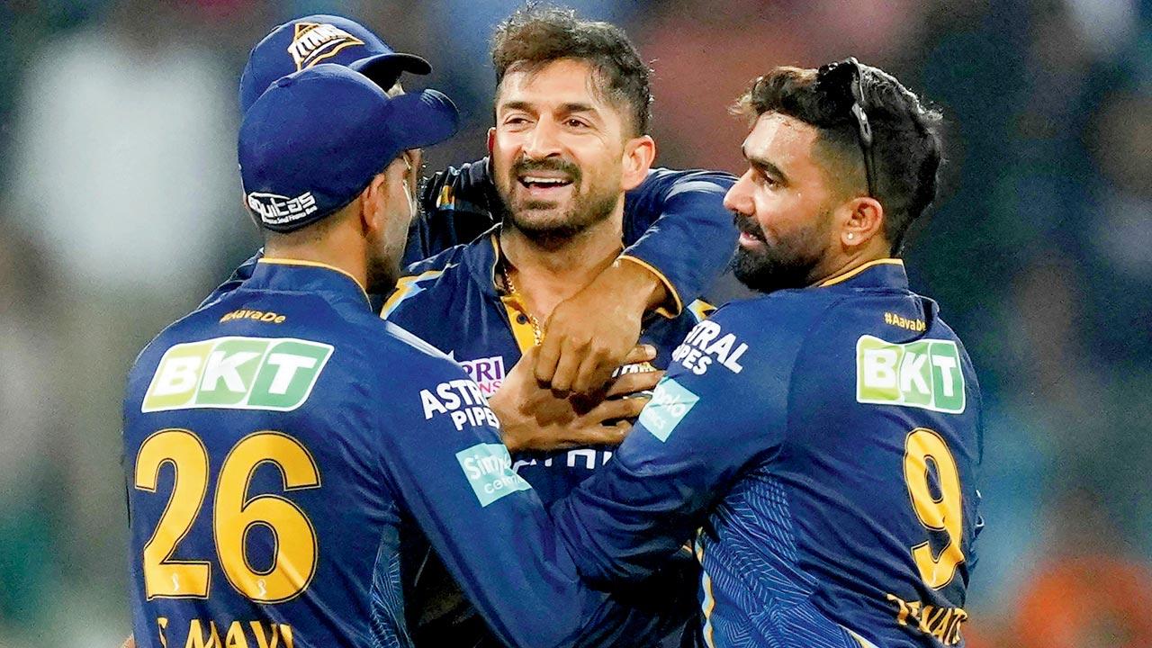 GT players celebrate a LSG wicket on Saturday. Pic/PTI