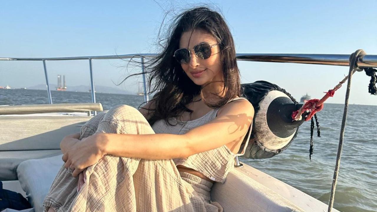Sporting stylish black sunglasses to beat the heat, Mouni Roy seems to be having a great hair day as she captions the pictures, 