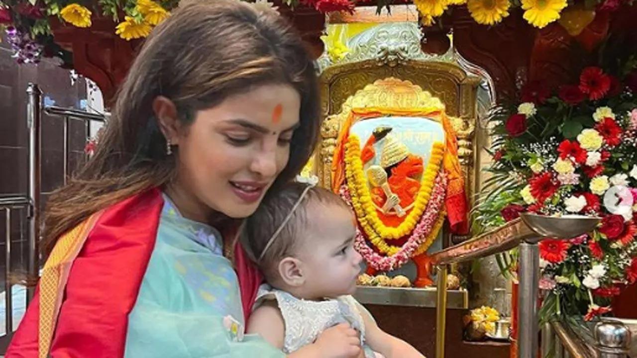 Global icon Priyanka Chopra who is busy promoting her upcoming web series 'Citadel' in Mumbai, on Thursday, visited Siddhivinayak Temple with her daughter Malti Marie to seek blessings. In the pictures, Priyanka can be seen holding Malti in her arms and was seen dressed in a traditional outfit. Read full story here