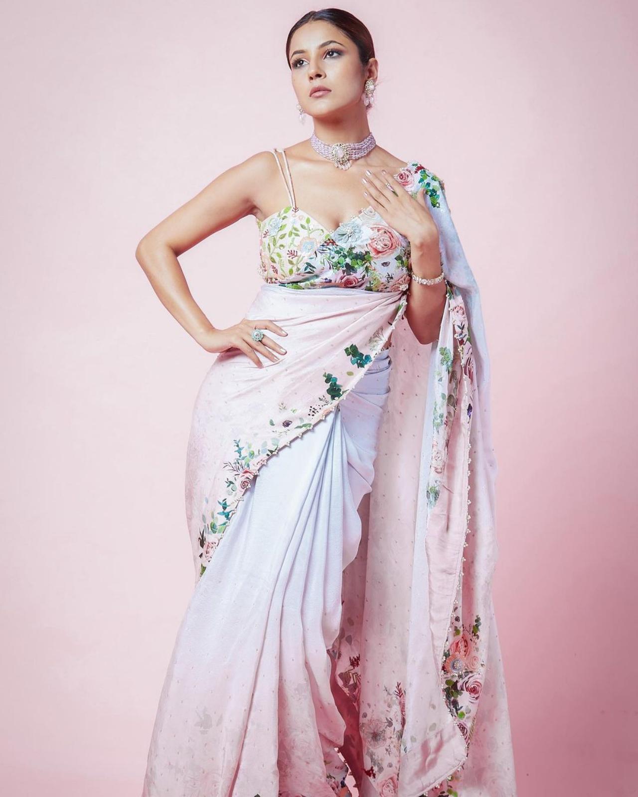 With an evergreen love for sarees, Shehnaaz bloomed in beauty with her floral print saree, topped off with a sleek bun.