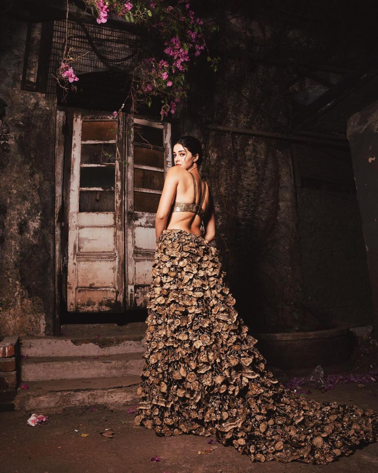 Ananya Panday opted for a creation by Rahul Mishra who also designed Zendaya's outfit. She is wearing The Tree of Life, black and gold 'Botanical' gown from Mishra's Couture Spring 2022 collection showcased at the Haute Couture Week in Paris.