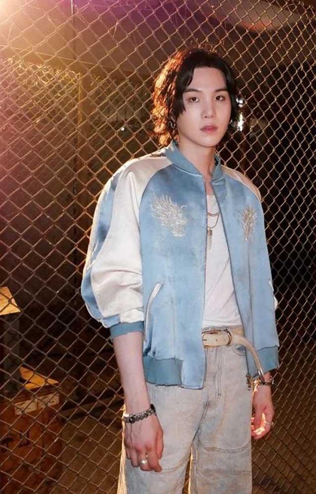 The intriguing trailer begins with Yoongi aka Suga lying on the street while it rains.