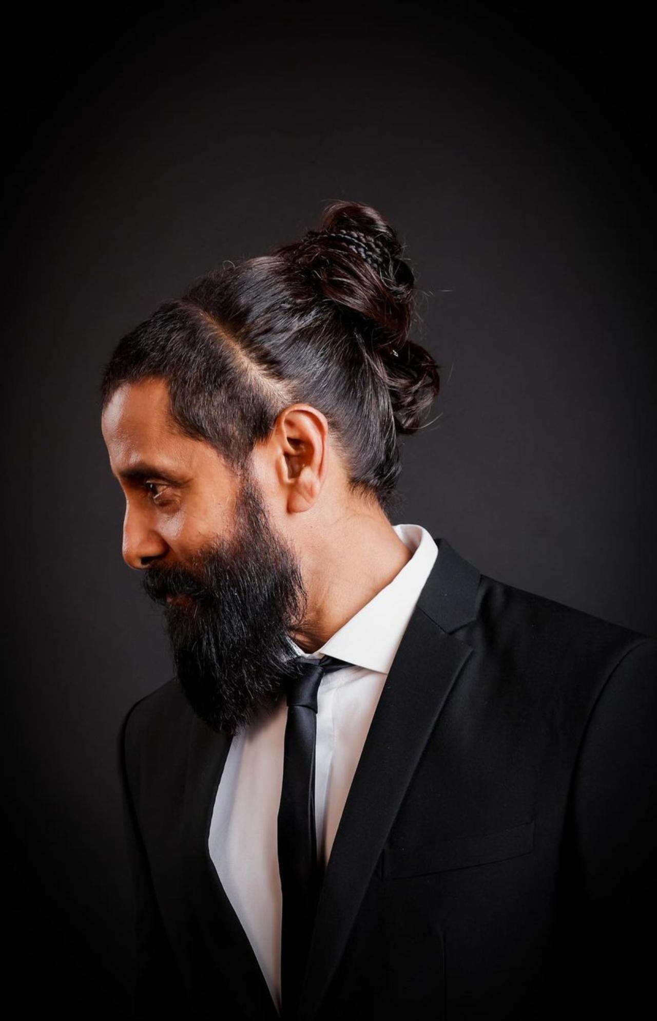 A week ago, Vikram shared this black-tie look with his hair innovatively tied in a bun. He shared the photos with a witty caption, 