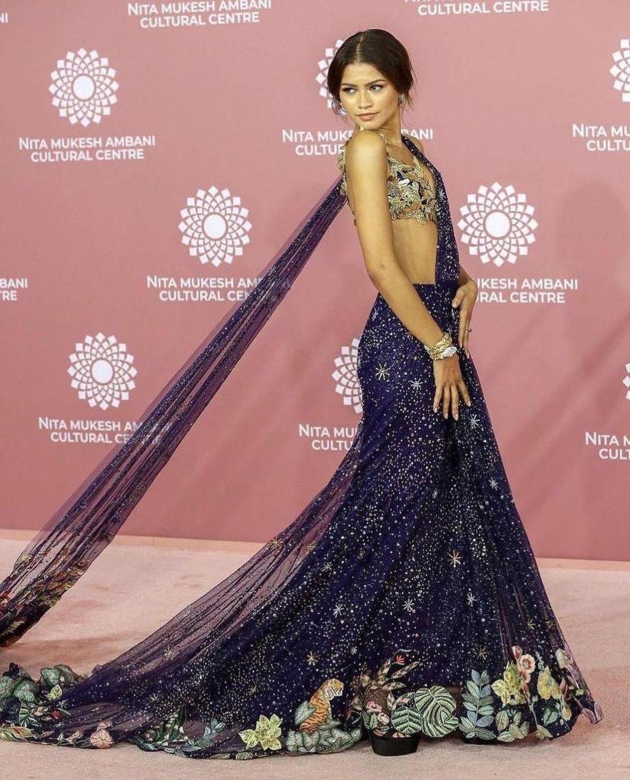 In her first visit to India, Zendaya impressed in a blue and gold saree designed by Rahul Mishra. Zendaya wore a hand embroidered 'Verdure' saree gown with the 'Flying Cranes' bralette