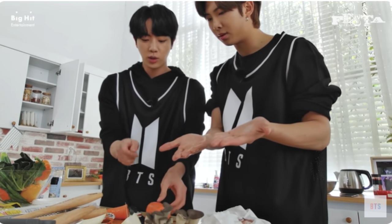 Here is Jin teaching Namjoon how to cut carrots without ending up in the emergency ward