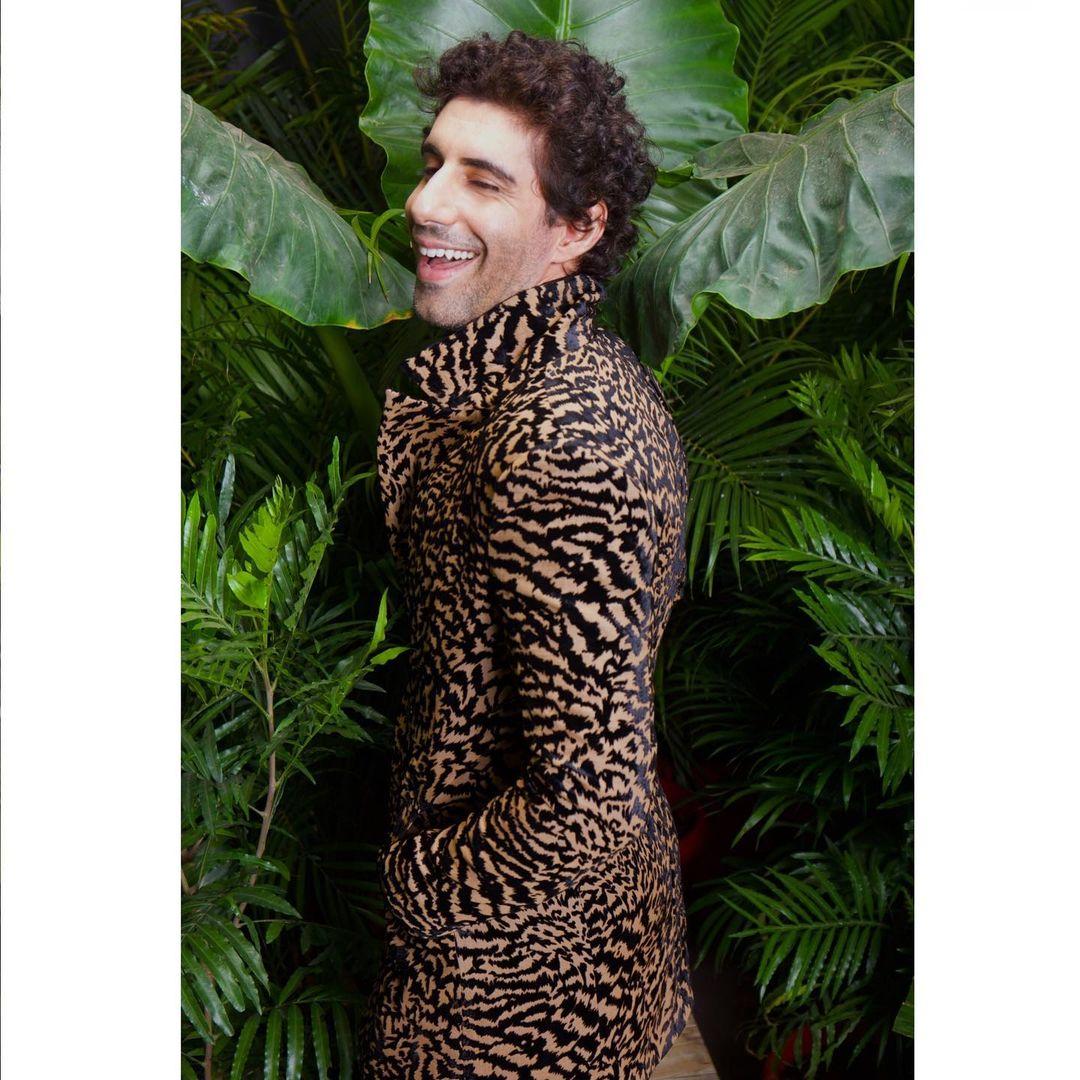 Jim Sarbh dons an intriguing animal-printed coat, exuding a captivating blend of boldness and flair. 