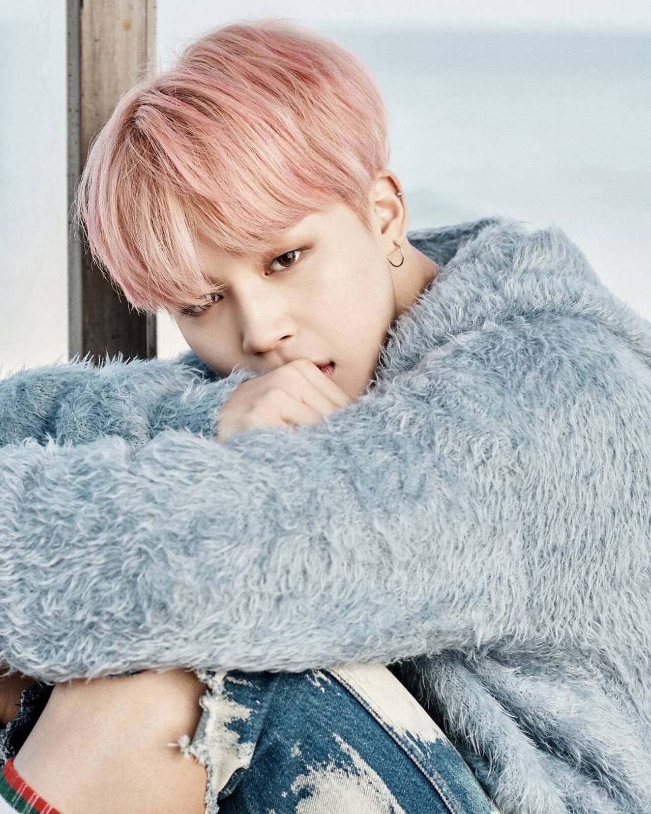 Jimin also embodied innocence and the atmospheric ethos of their 'You Never Walk Alone' album when he dyed his hair a metallic and muted pink colour when shooting the music video for Spring Day