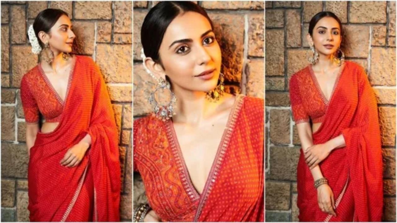 Rakul Preet
Rakul wore a bright red bandhani-print saree adorned with sequins, orange patterns, and silver gota patti borders. She styled it traditionally with the pallu draping over her shoulder, paired with an intricately embroidered V-neck blouse