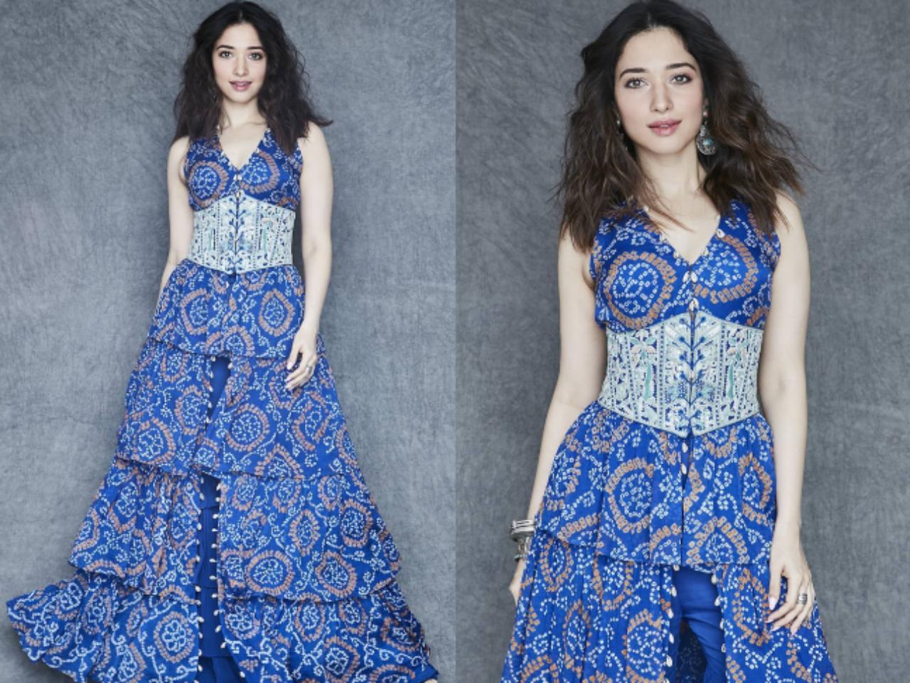 Tamannaah Bhatia
For the 'Bole Chudiyan' press conference, stylist Sukriti Grover chose an electric blue ensemble from Arpita’s Folklore collection for Tamannah. The outfit featured a tiered-ruffle jacket highlighting bandhani work, paired with a tie-up corset in a contrasting lighter blue. The ensemble was completed with solid electric blue gharara pants