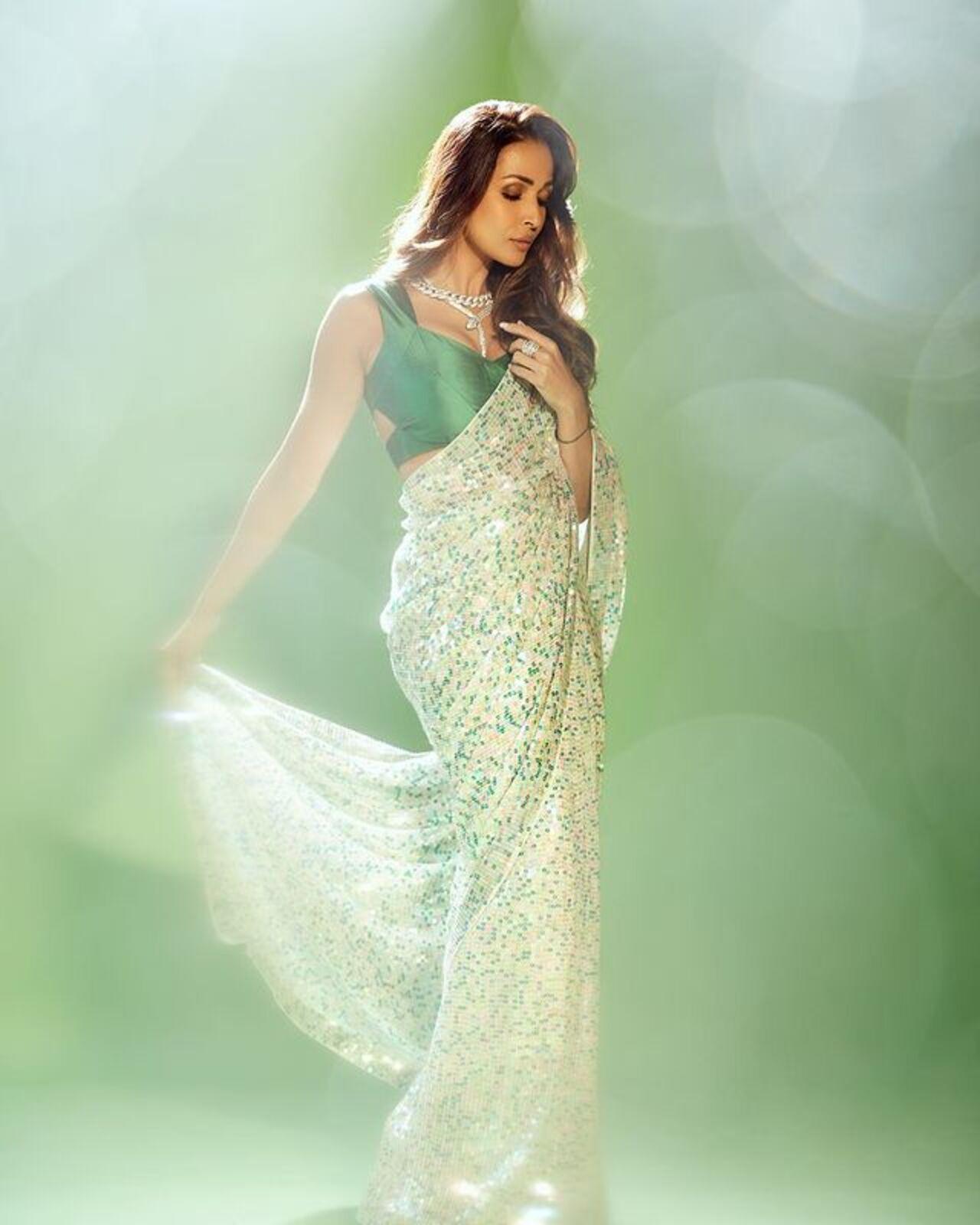 Malaika Arora looked regal in her deep forest green silk blouse and a sequinned silver-green saree. Pair your own Hariyali Teej outfit with a statement necklace like Malaika's as we guaruntee you will look as gorgeous!