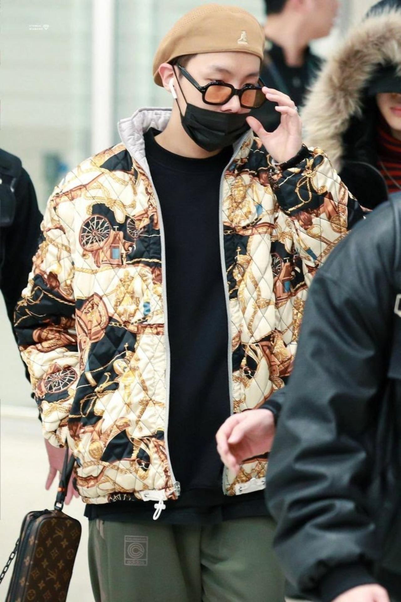 J-Hope and extravagance go hand in hand. The artist is known to pull off some extremely unconventional and flashy fashion choices. If not styled well, this bomber jacket could have come off as bulky but it looks perfect on lithe Hobi