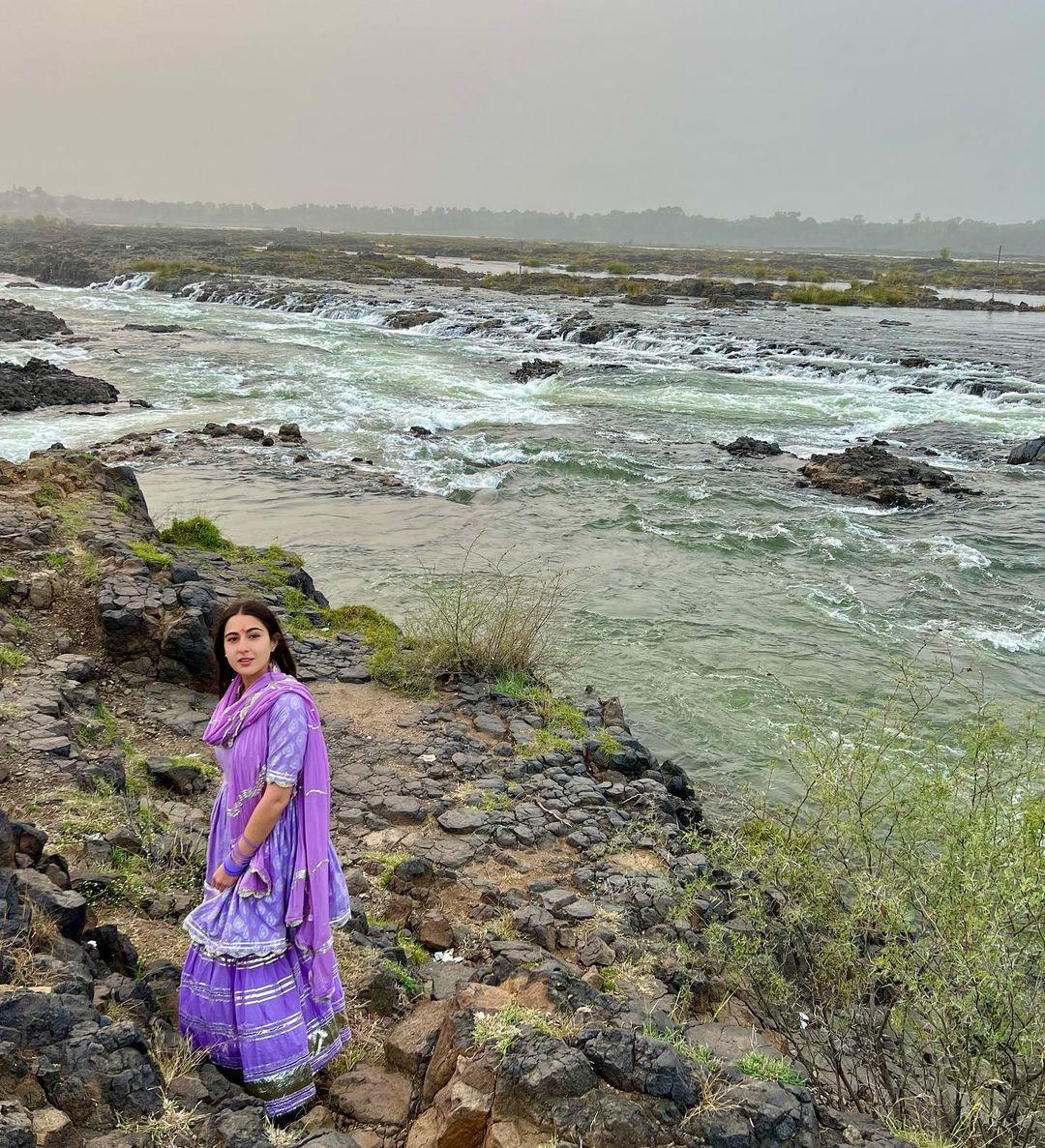 The rich purple hue of the salwar suit exudes an air of royalty (which she is), reflecting Sara's confident presence and inherent grace.