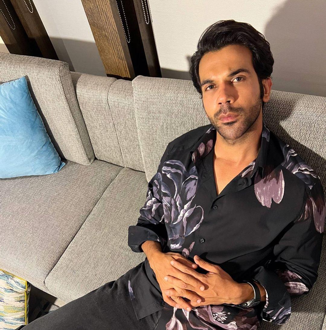 Rajkummar Rao effortlessly channels a casual and vibrant vibe in a shirt adorned with a playful floral print. The blossoming flowers infuse his outfit with a sense of natural ease.