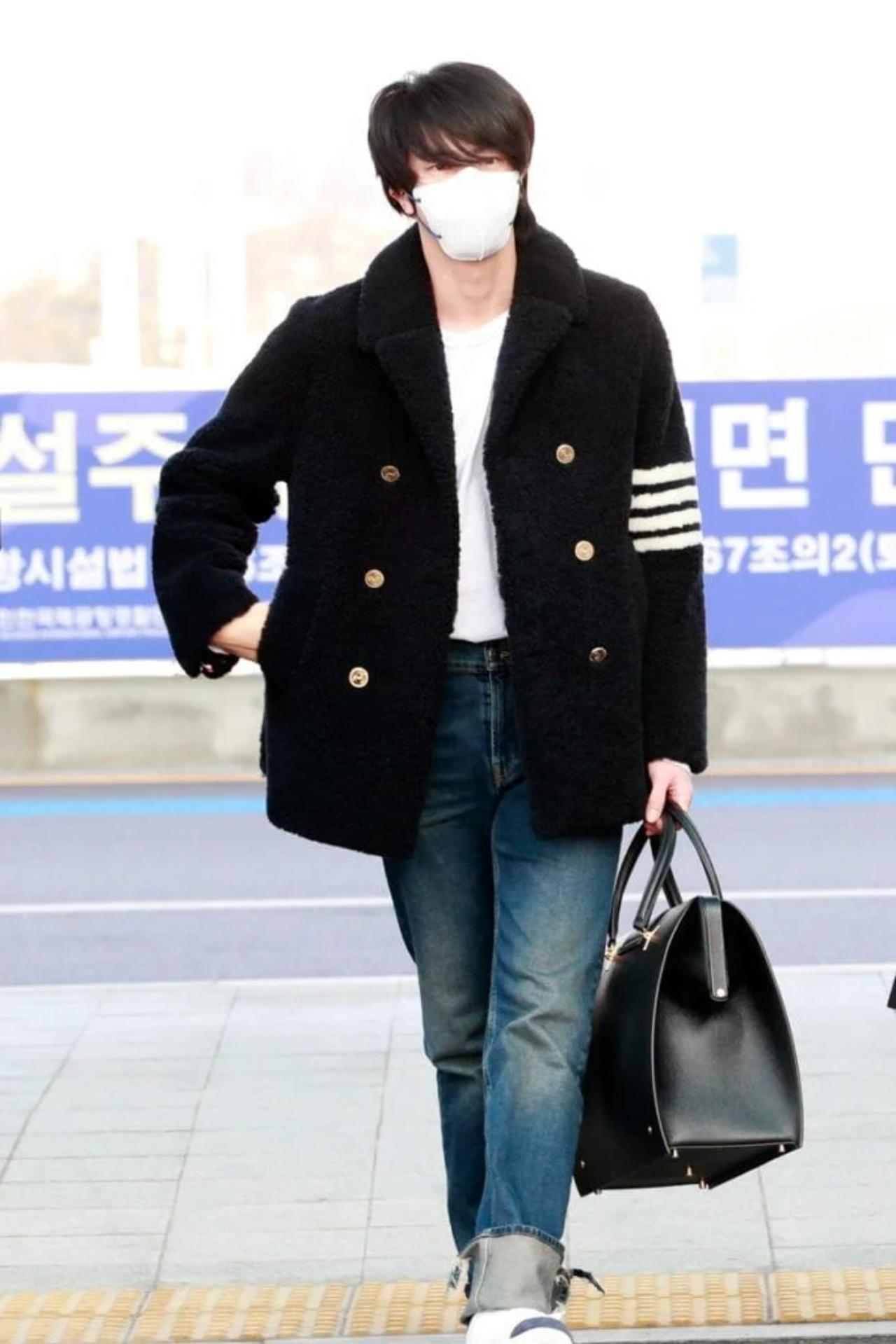 But let's admit it, Jin isn't extra every single time when it comes to his sartorial choices. For instance, how cute does he look in this cosy oversized black coat at the airport?
