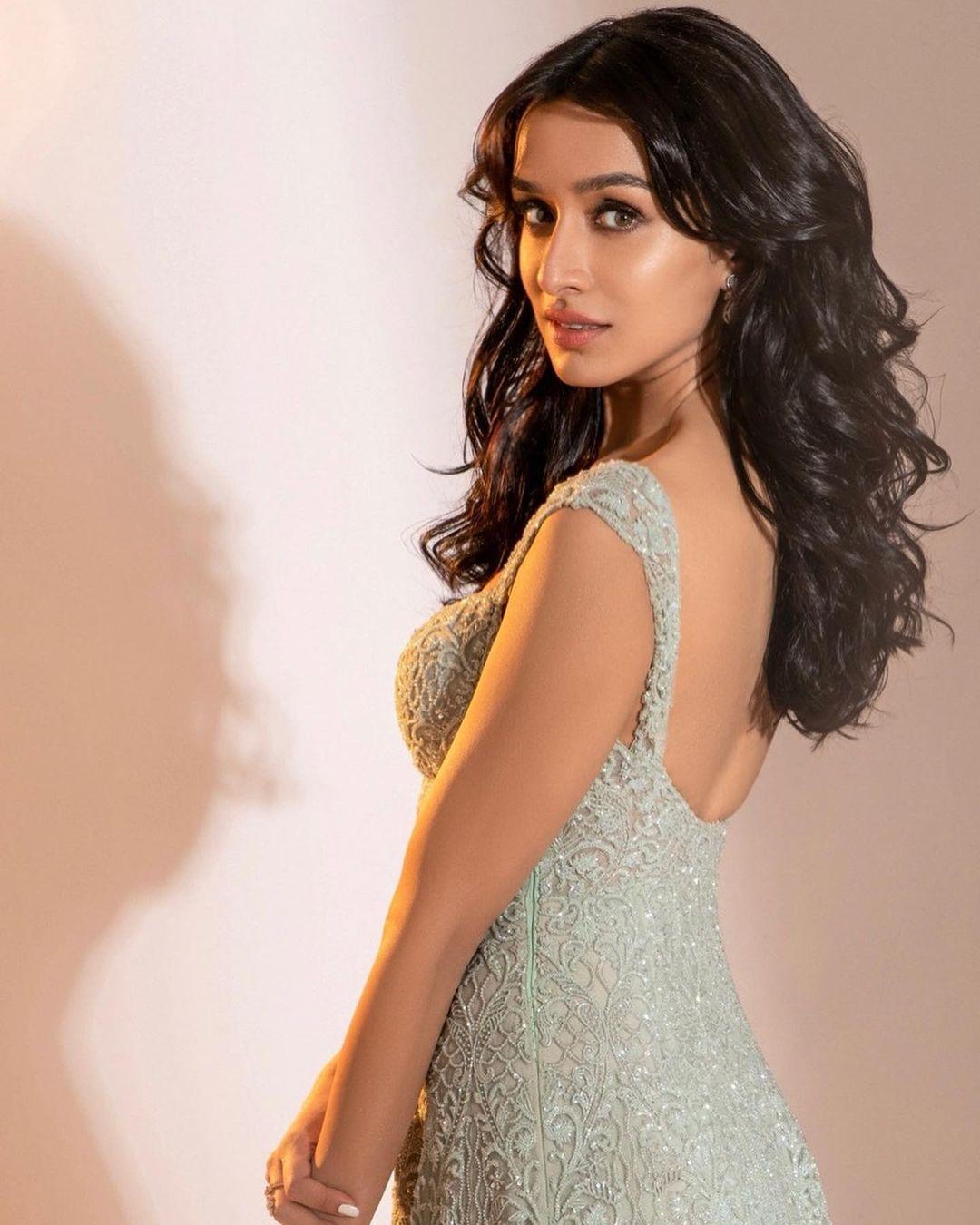Shraddha Kapoor redefines the very essence of elegance and grace as she graces the camera in a mesmerizing ivory shimmery gown crafted by the renowned designer Kresha. 
