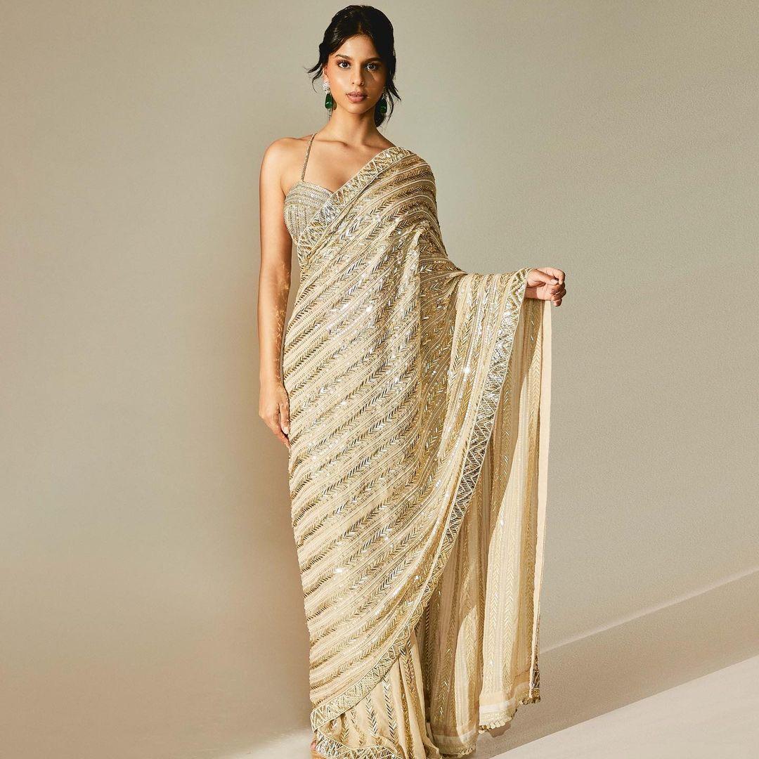 Suhana donned this Manish Malhotra off white saree with hues of gold