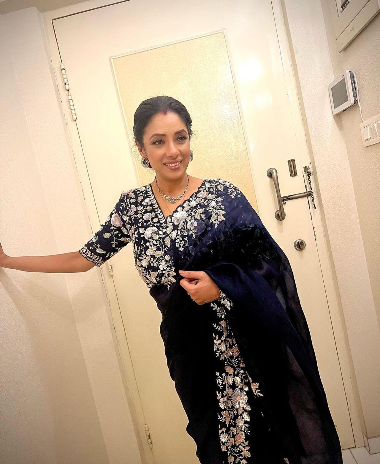 Rupali Ganguly looked resplendent in a blue saree with a heavy border, complemented by a matching blouse