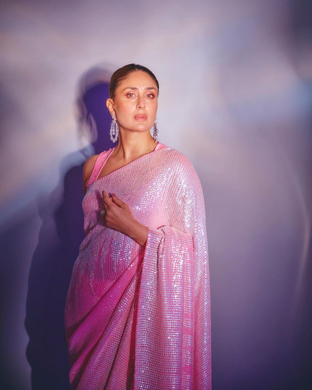 The six-yard wonder featured a delicate play of textures, with intricate embroidery and sequin work adorning the sheer pallu. The embellishments caught the light in a mesmerizing dance, casting a subtle shimmer that added an element of glamour to the ensemble. The border of the saree was exquisitely detailed, showcasing Manish Malhotra's signature design finesse.