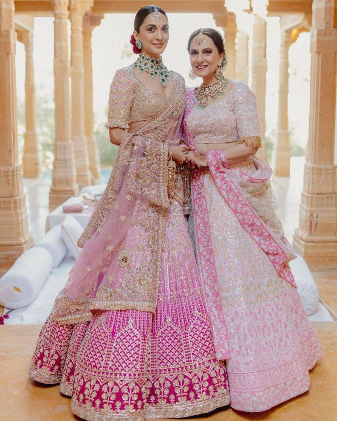 Kiara Advani pulls off Manish Malhotra's outfits perfectly, and even opted for a bridal lehenga by his label for her wedding to Sidharth Malhotra. The lehenga showcased a gradient of light pink with darker borders, a hue which Manish Malhotra aptly termed as 'empress pink'. The design draws inspiration from Roman architecture, reflecting the newlyweds' shared affection for the city renowned for its domes. The intricate embroidery is accentuated by genuine Swarovski crystals, adding a radiant sparkle. Kiara also made a modern fashion statement by opting for emerald studs instead of traditional wedding danglers