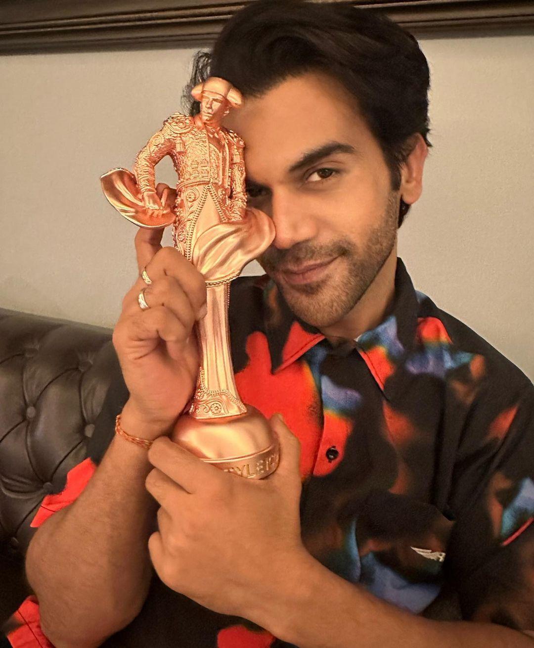 Rajkummar Rao radiates a casual and energetic vibe in a multi-colored shirt that seamlessly blends various hues.