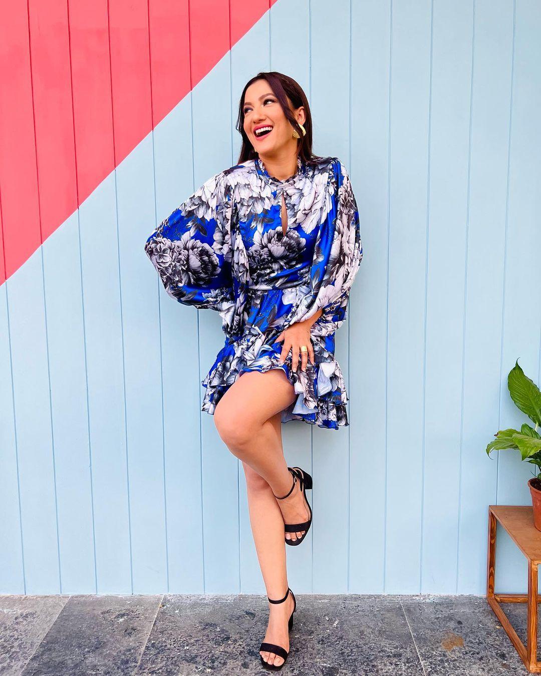 Skipping ahead in time, Gauahar's fashion prowess continued to soar. In this snapshot, she absolutely nailed it in a delightful blue layered dress adorned with a captivating display of floral prints.