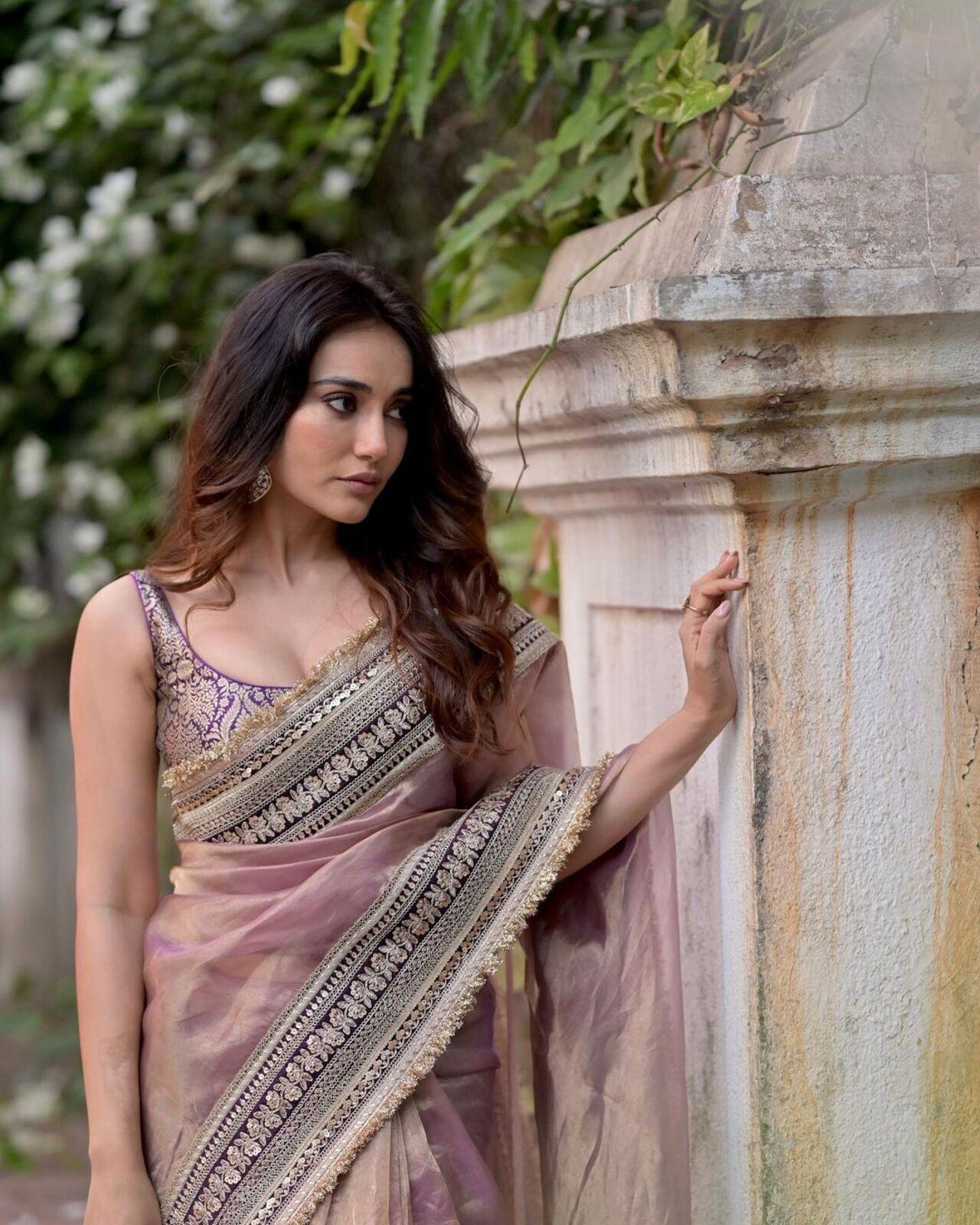 Surbhi Jyoti gracefully donned a stunning pink saree delicately infused with a touch of purple