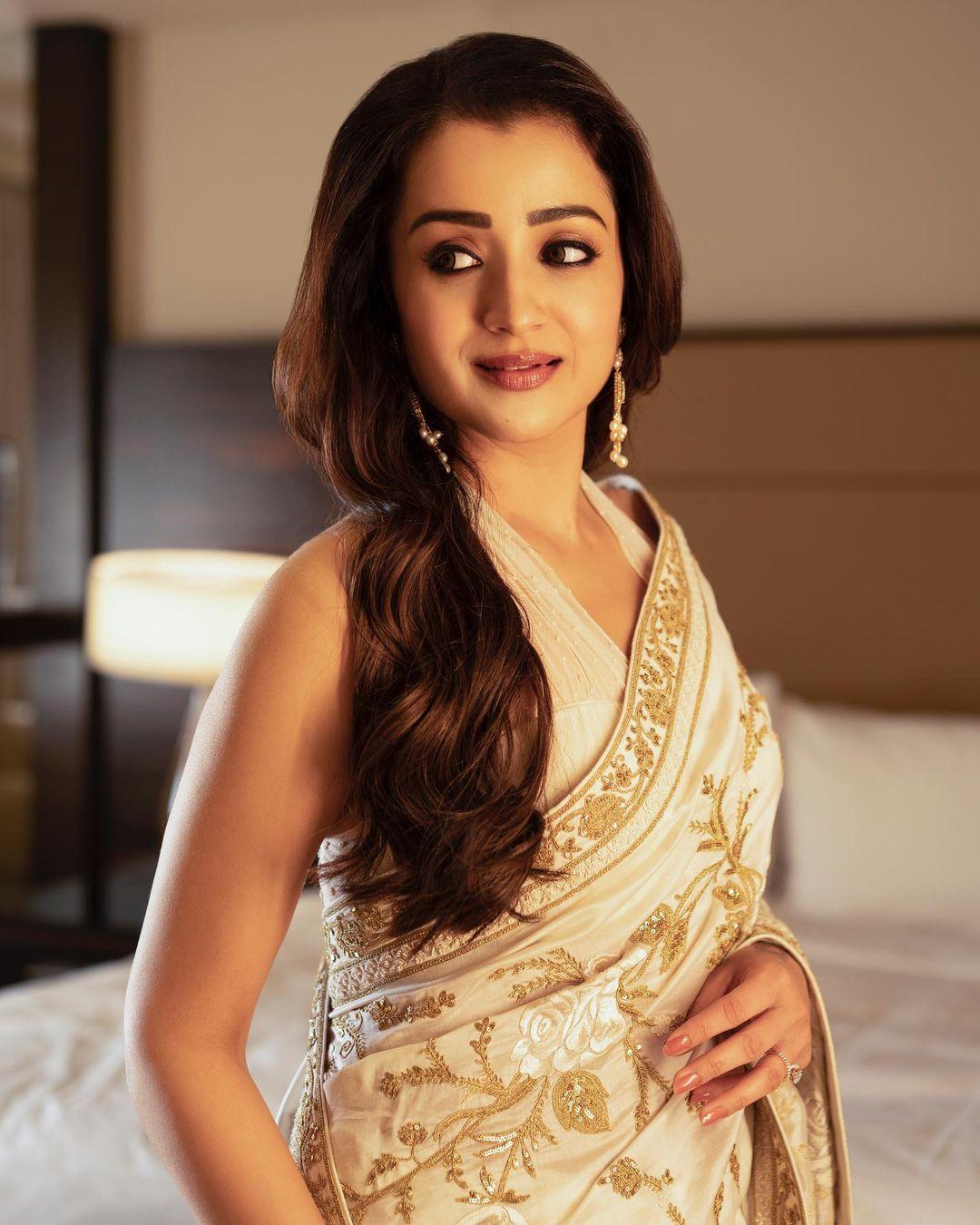 In a fashion move that beautifully bridges tradition and modernity, Trisha Krishnan brings a fresh perspective to the timeless white and gold saree.