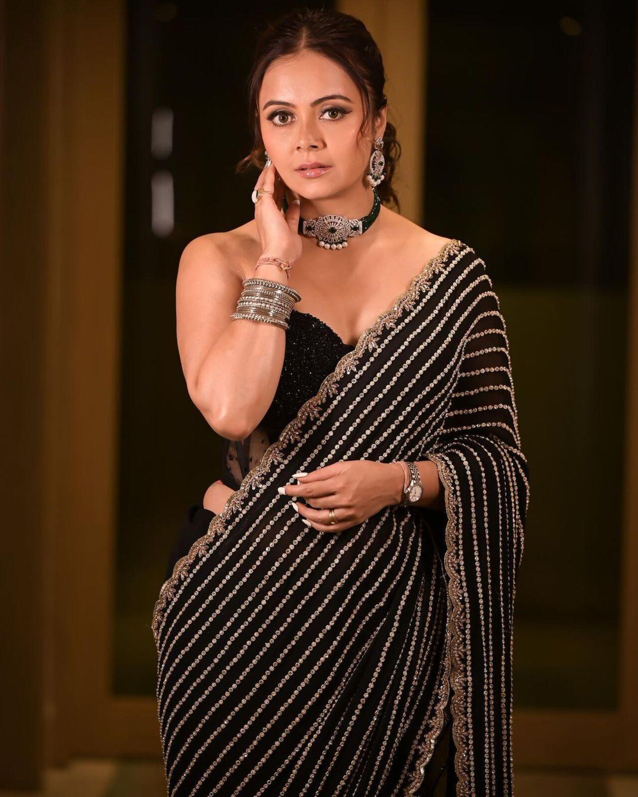 Devoleena completed her look with intricate earrings and a choker. The actress also wore stunning silver bangles and a watch. Her hair was done in a stylish ponytail