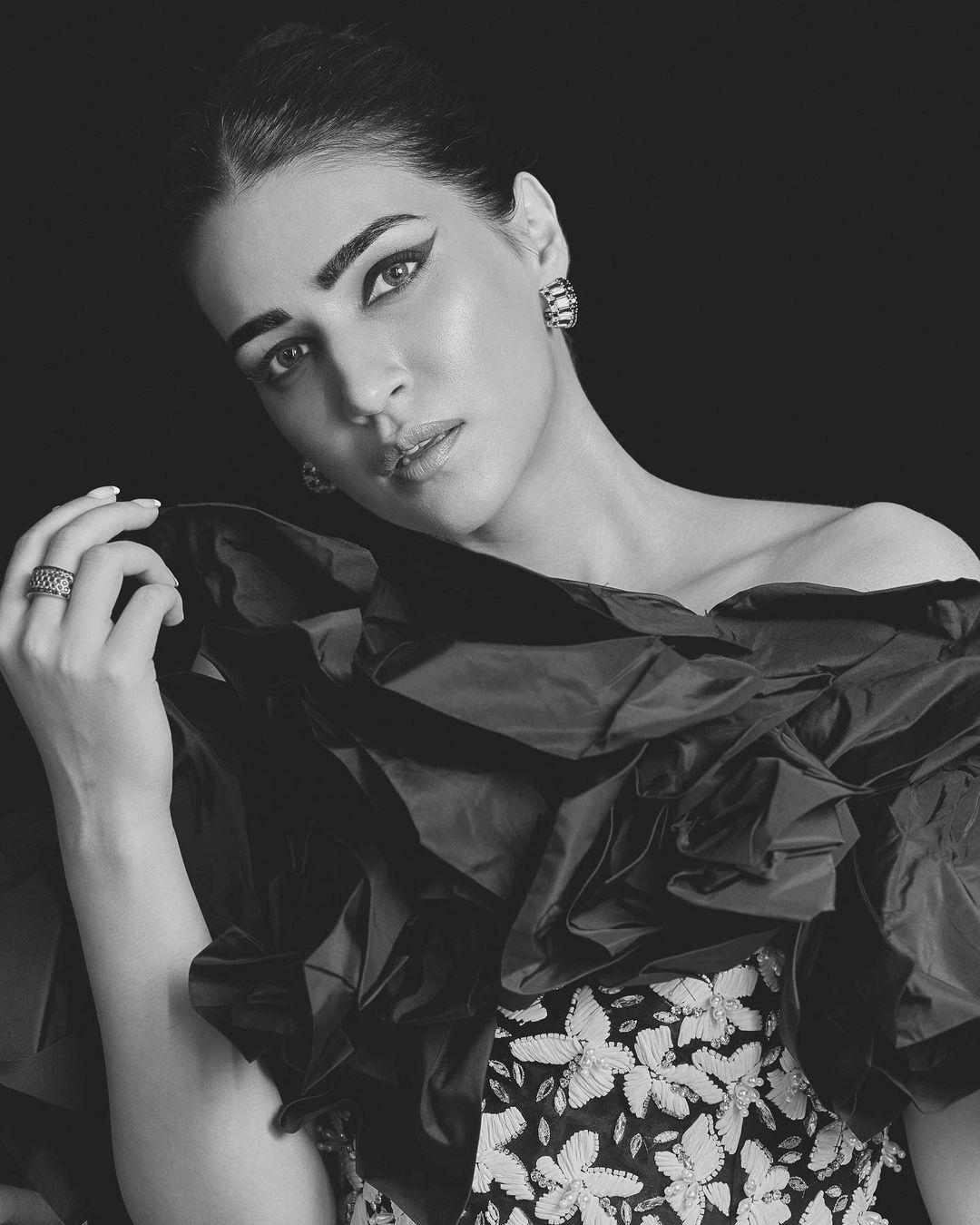 These intricate floral patterns adorned the entirety of the black fabric, creating a stunning contrast that made the ensemble come alive. The juxtaposition of the deep black hue and the pristine white florals created a visual spectacle that was both mesmerizing and enchanting.