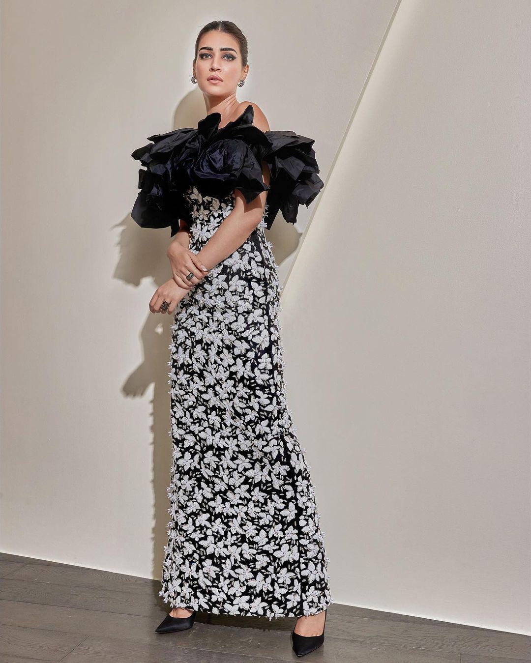 What truly set the outfit apart were the delicate white floral embellishments that adorned the dress.