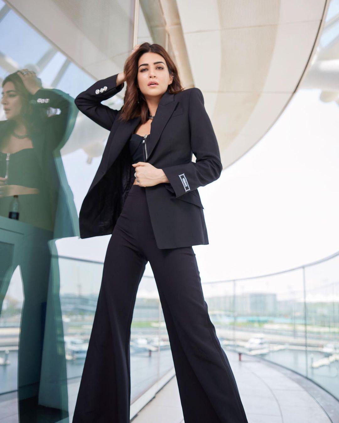 Kriti Sanon, renowned for her fashion-forward choices, once again showcased her impeccable style by opting for a distinctive ensemble that seamlessly blended classic and contemporary elements. 