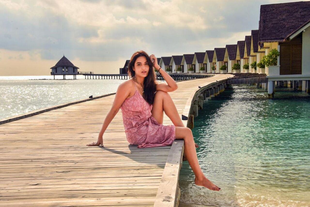 In this picture, Jasmine Bhasin looks stunning as she dons a gorgeous printed pink strappy dress
