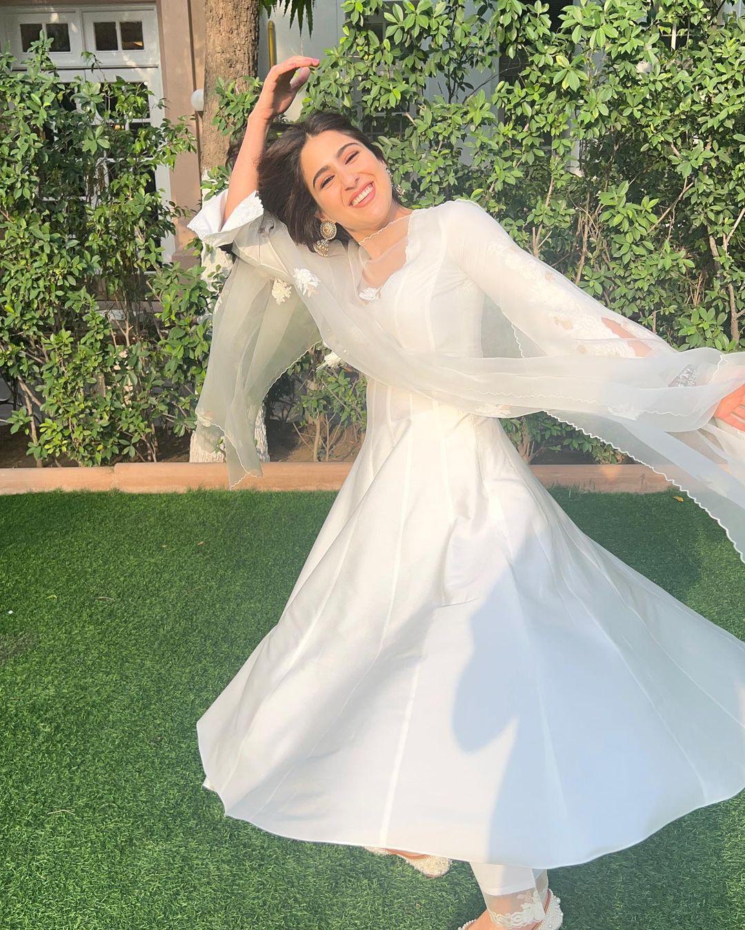 Her infectious energy creates a magical dance, as the suit transforms from a mere garment into a vibrant symphony of style