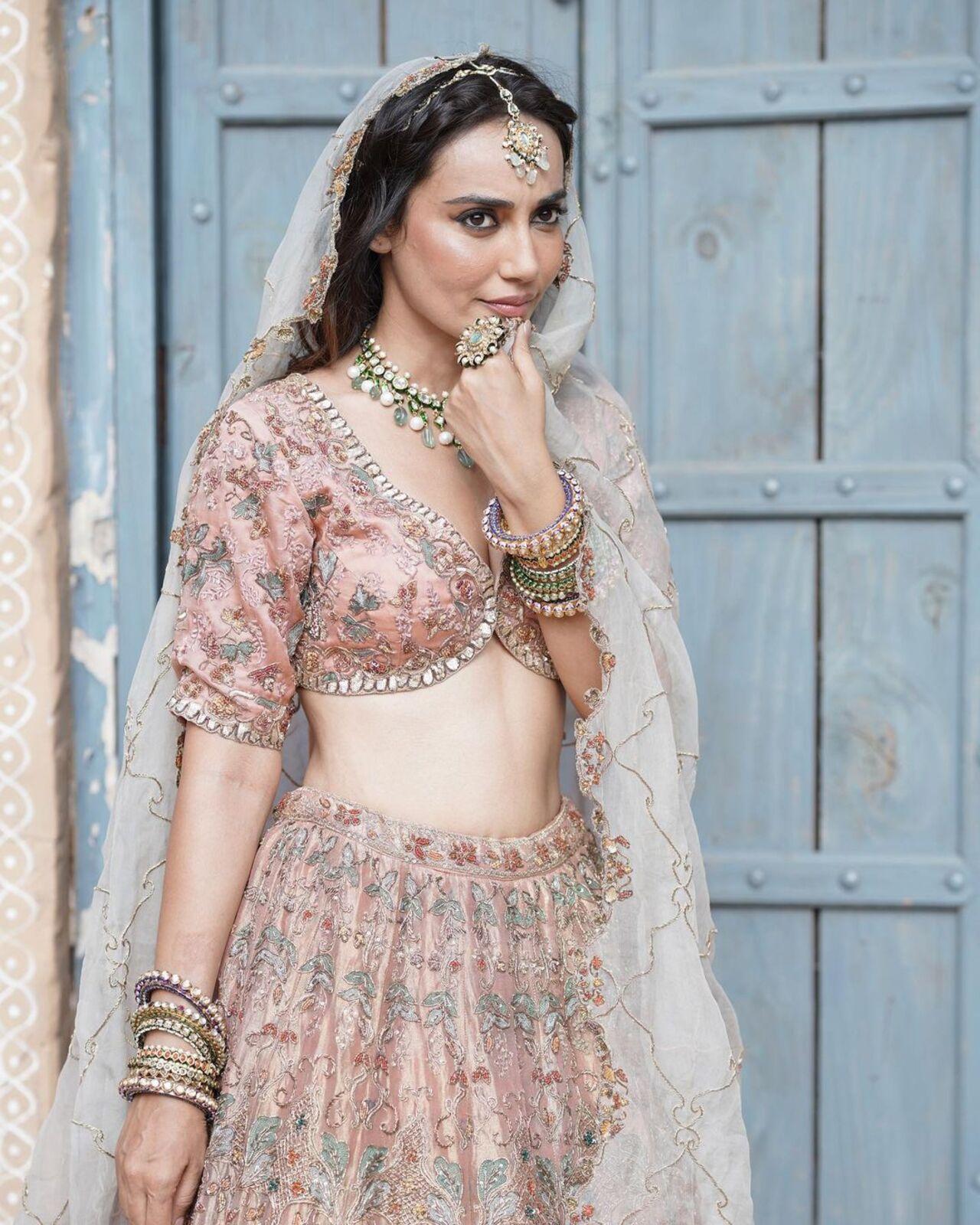 In this look, Surbhi Jyoti shelled fashion goals as she effortlessly mastered a traditional lehenga choli. Dressed in an exquisite heavy-embroidered peach lehenga set, she looked absolutely stunning 
