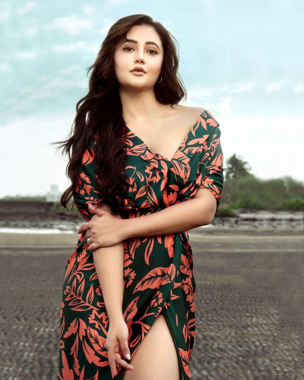 Rashami's hair was styled in loose, cascading curls, creating a soft and natural look