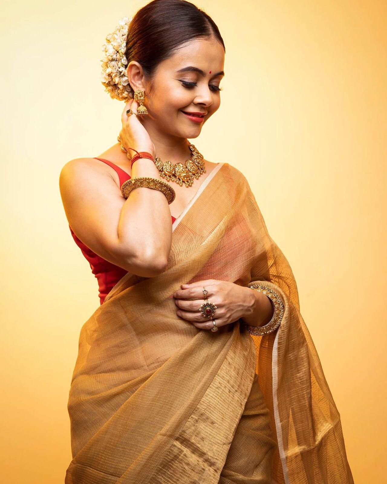 Her hair was done in a neat bun with gajra, which elevated her entire look