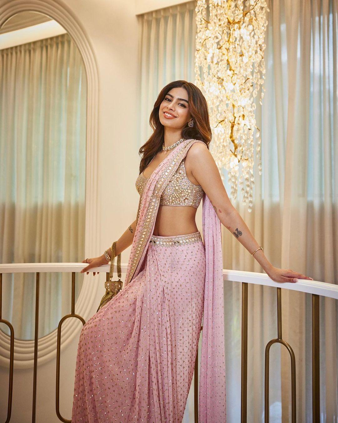 Khushi Kapoor looked absolutely stunning in a pink mirror-worked saree. Her outfit showcased a perfect blend of traditional and contemporary styles