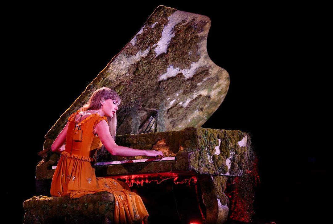 Continuing to expand her collection of exquisitely designed dresses, Swift adorned herself in a custom-made orange Etro gown that stood as a testament to her impeccable taste. The gown's embroidered ruffled bodice added a sense of playful sophistication, creating a harmonious blend of boldness and elegance. Swift's choice in fashion once again demonstrated her ability to transform the stage into a canvas of creativity and style, as she effortlessly embodied the spirit of the gown with her captivating presence.