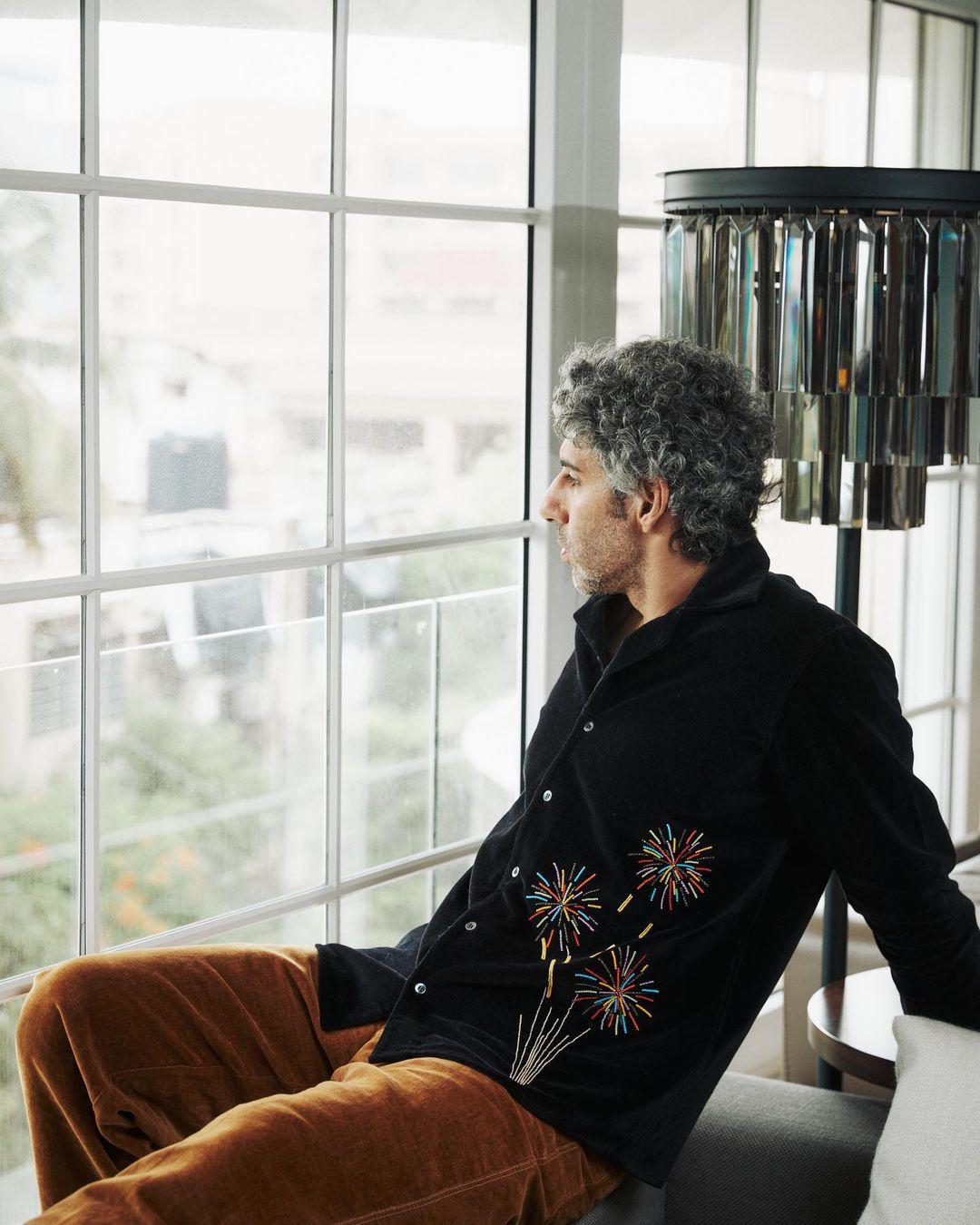 In a striking ensemble that exudes effortless style, Jim Sarbh dons a sleek black jacket adorned with a subtle yet eye-catching pattern. The jacket's intricate design adds a touch of uniqueness to the classic black, demonstrating his keen eye for detail.