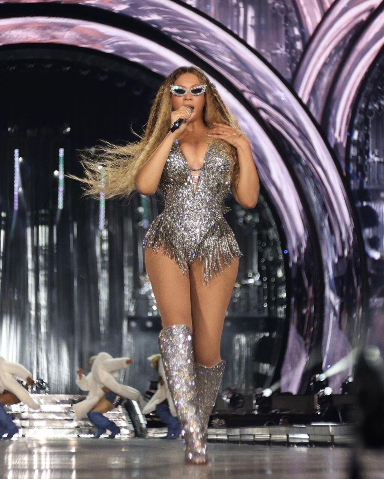 During her debut performance, Beyonce wore a custom Gucci bodysuit adorned with silver sequins and crystals, paired with matching over-the-knee boots