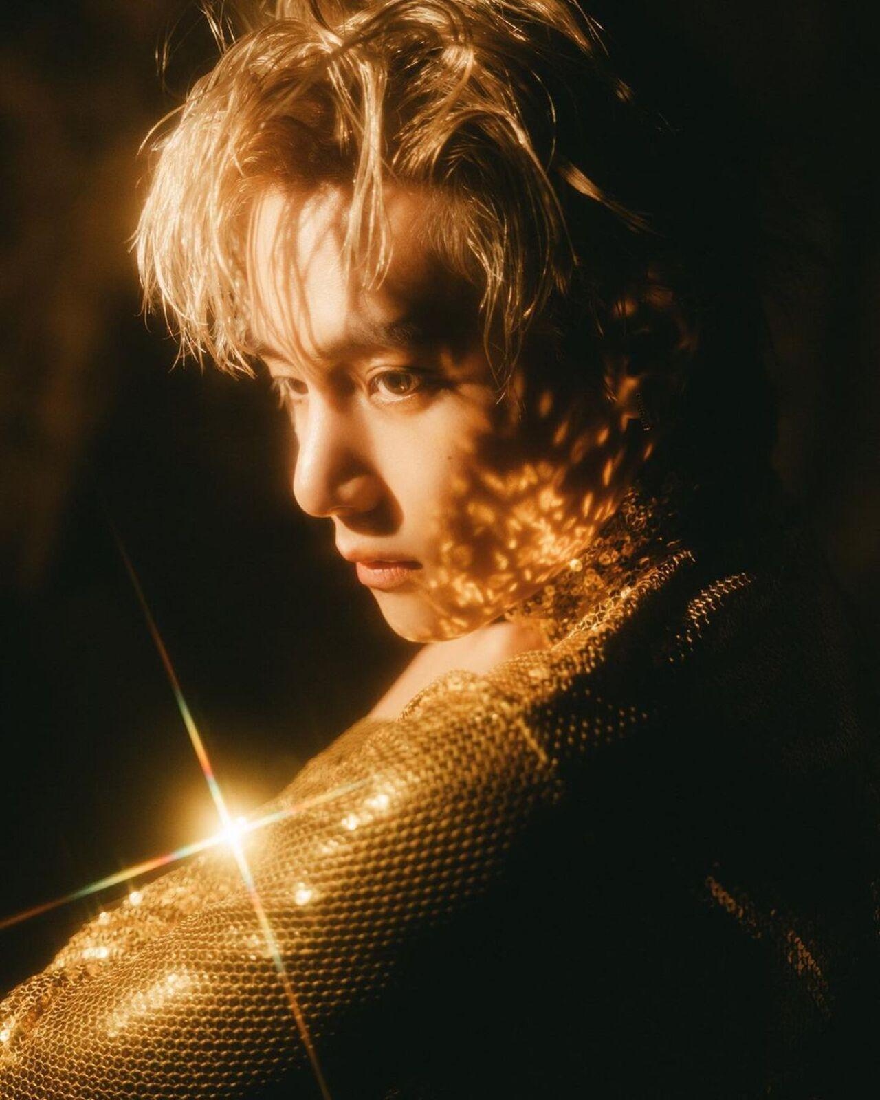 Taehyung dazzled in a glittery gold outfit in his 'Love Me Again' music video from 'Layover.' His sensual vocals and attractive visuals only add to the atmosphere of the song!