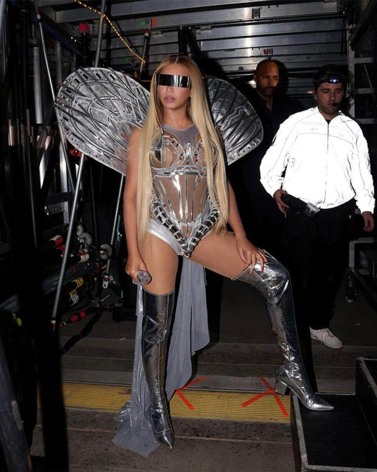 Winged fairy! In another risque move, Beyonce donned this flashy sheer emsemble with thigh-high boots