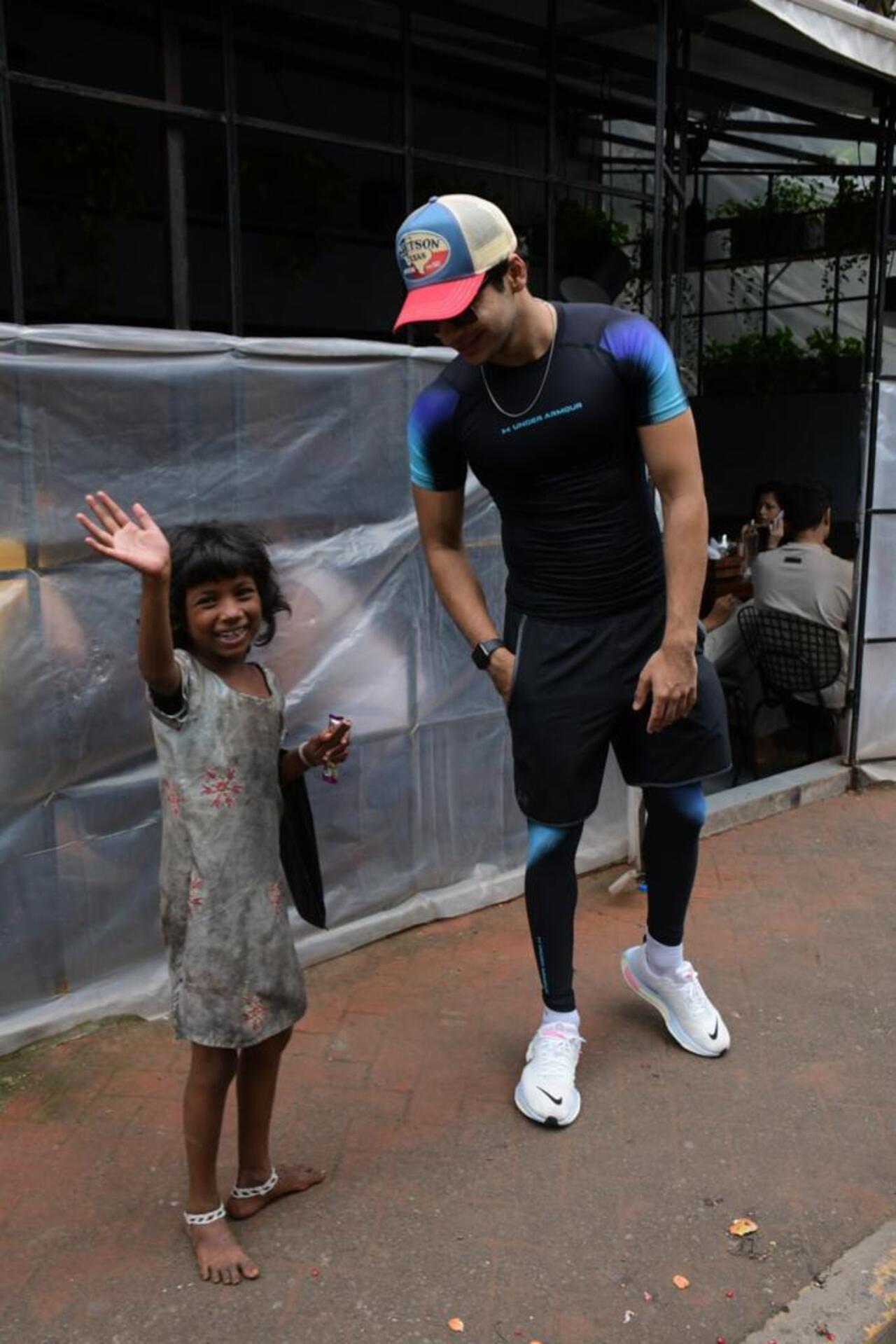 Ishaan Khatter was snapped as he possed for the paparazzi with his little fan