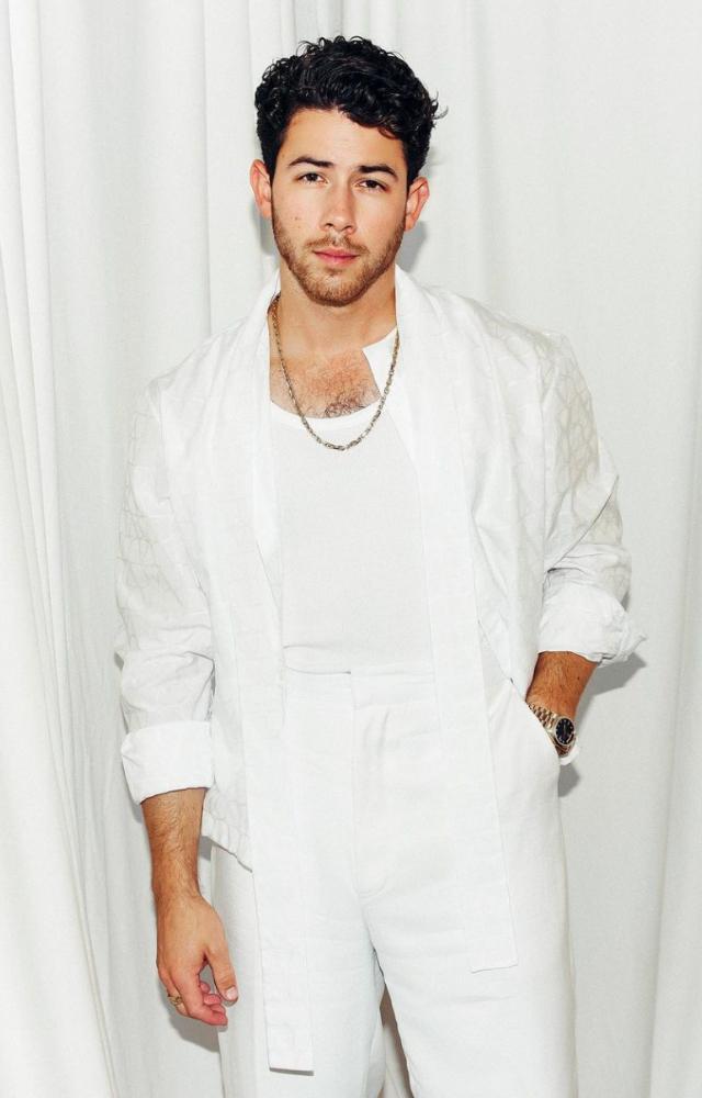 Nick, on the other hand, looked stage-ready in his dazzling and crisp all-white ensemble. The chain around his neck definitely added to his rockstar energy