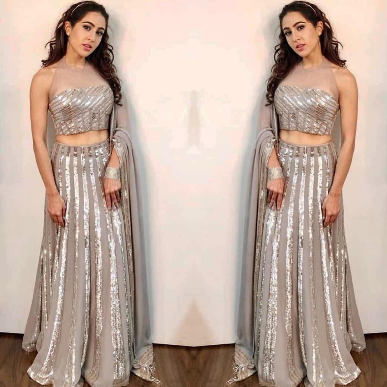 Sara Ali Khan
Sara seems to have taken some inspiration from Taylor Swift's 'Bejeweled'! She looked beautiful in this shimmery silver Manish Malhotra ensemble